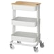 A white RÅSKOG utility cart with three shelves and a bamboo lid top. Its on wheels for easy movement.