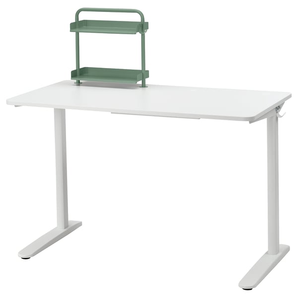 White RELATERA desk with adjustable green shelf for organisation.