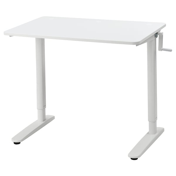 A white adjustable desk, RELATERA, with a crank handle for height adjustment, suitable for both sitting and standing.