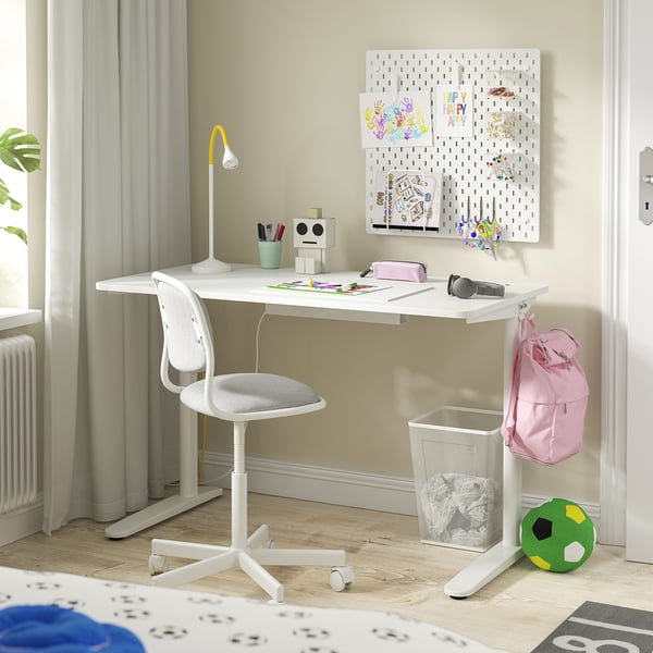A white RELATERA kids desk with a swivel chair and pegboard.
