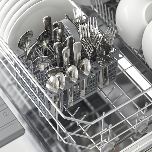 Dishwasher basket holds cutlery, dried post-wash.