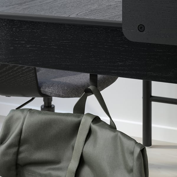 Desk with 2 drawers, glass top, & bag hook, black metal legs. Hook holds a bag handy.
