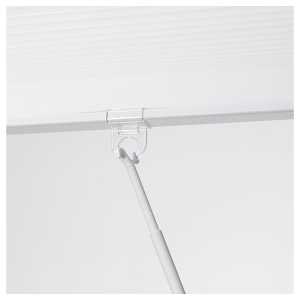 Clear plastic rod clipping onto a white fabric blind, allowing easy control and adjustment.