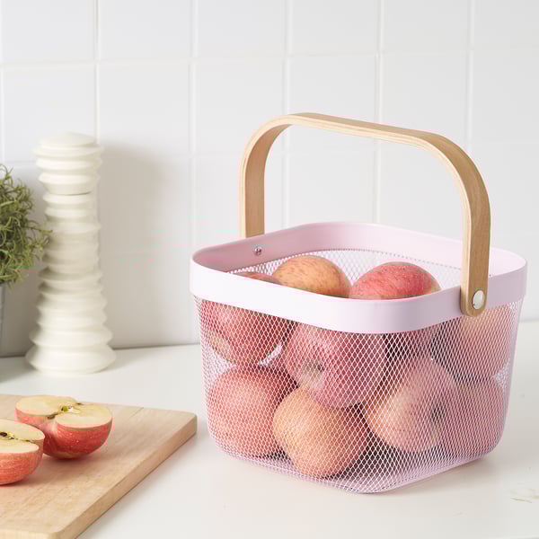 Mesh basket with wooden handle holds fruits, ventilates for freshness.