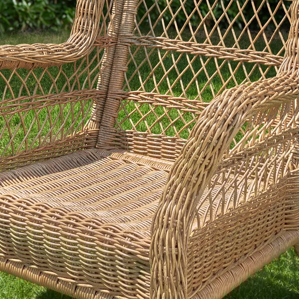 Woven wicker patio chair showcasing intricate craftsmanship, highlighting its durable, weather-resistant design.