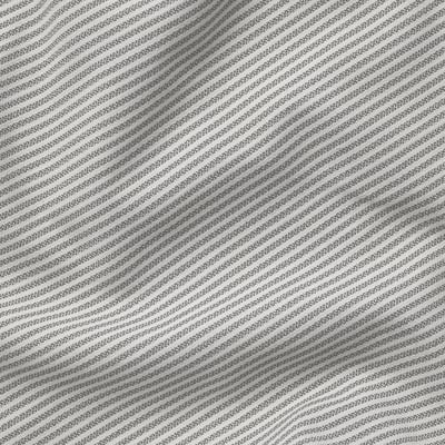 Close-up of striped, textured polyester fabric, clean, and orderly, showing high-quality material.