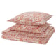 RODGERSIA bedding set: orange paisley print, soft cotton blend, includes duvet and pillowcases, neatly folded.