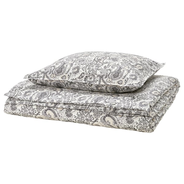 RODGERSIA bedset, grey paisley print, folded with pillow. Cotton & viscose blend. Intricate floral design. Neutral, stylish.