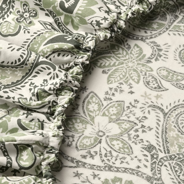 Elegant paisley-patterned bed sheet with intricate ruffles, showcasing high-quality fabric blend for softness and durability.