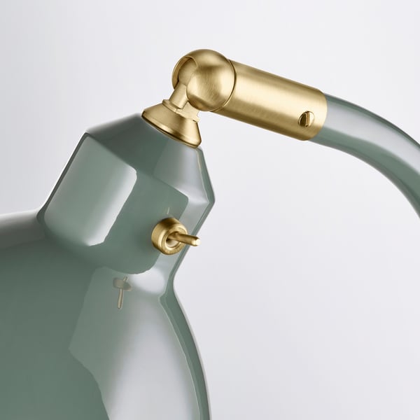 Desk lamp with green shade.