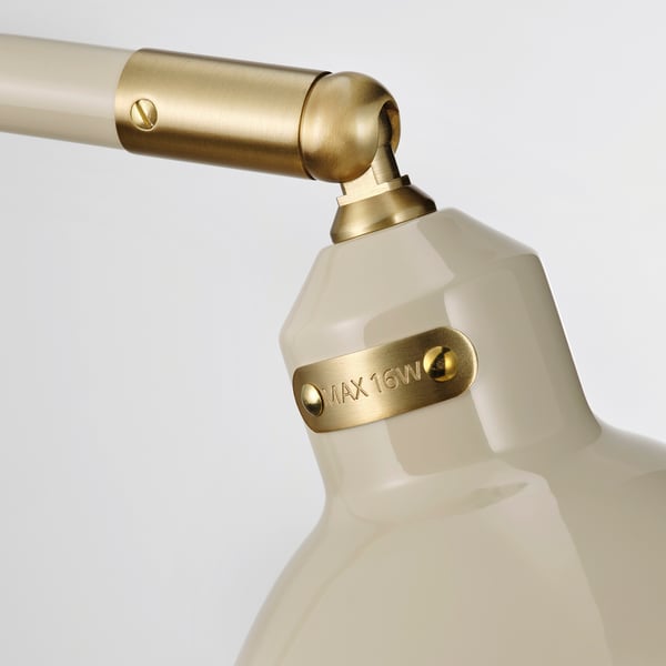 Modern lamp with gold accents; adjustable neck and white shade; max 16w label on base.