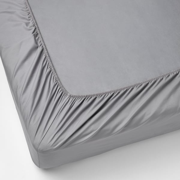 A fitted grey bed sheet with elastic edges, covering a mattress up to 36 cm thick.