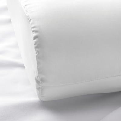 Close-up of premium cotton and lyocell pillowcase, showcasing smooth, crisp texture and meticulous stitching.
