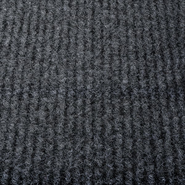 Close-up view of soft, textured RUNNEN floor decking in black, showcasing its quality and texture.