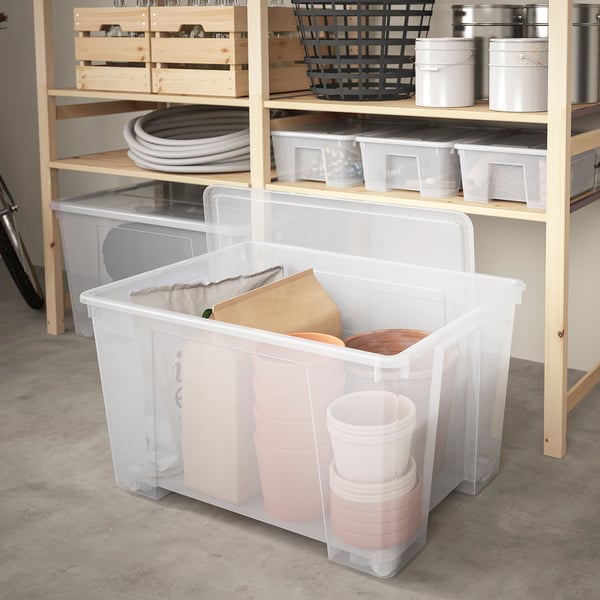 Clear large plastic storage container, SAMLA brand, holds various items, sits on floor or shelf, easy to see contents, 20x15x12 inches.