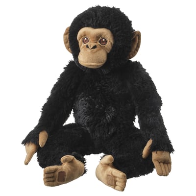 Black stuffed monkey toy, sitting, soft, realistic face, brown hands and feet.