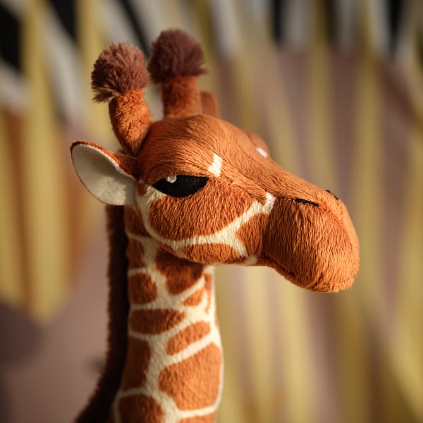 Stuff giraffe close-up; soft, quality fabric; bright, vibrant eye detail