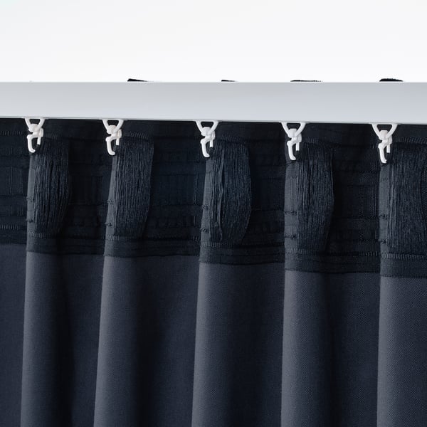 This image shows SANELA curtains with hooks. The curtains are dark blue and made of pure cotton velvet with multi-way hanging options.