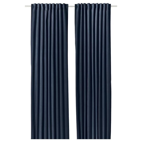 Dark blue SANELA curtains, made of pure cotton velvet, draped elegantly with pleats, room-darkening effect.
