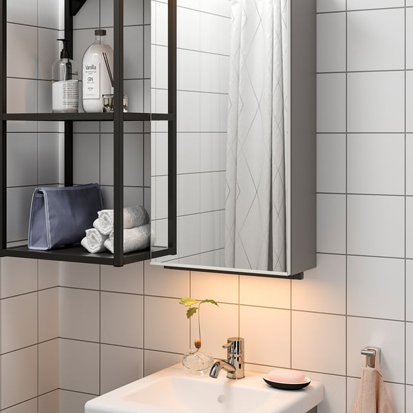 Modern bathroom with mirrored cabinet. Under-sink led lighting provides work and ambiance, enhancing morning routines.