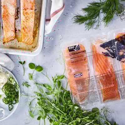 Meal prep: fresh salmon, frozen fillets, and herbs.