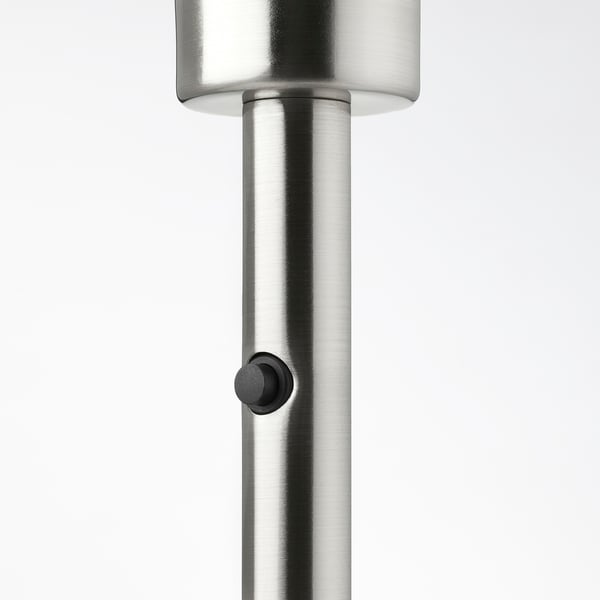 Sleek silver lamp base, modern design, high-quality steel and plastic construction, with a black control button.