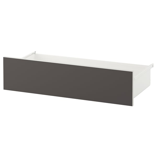 A SKATVAL drawer unit in white with a grey front panel. It has a rectangular shape with a sleek, minimalist design.