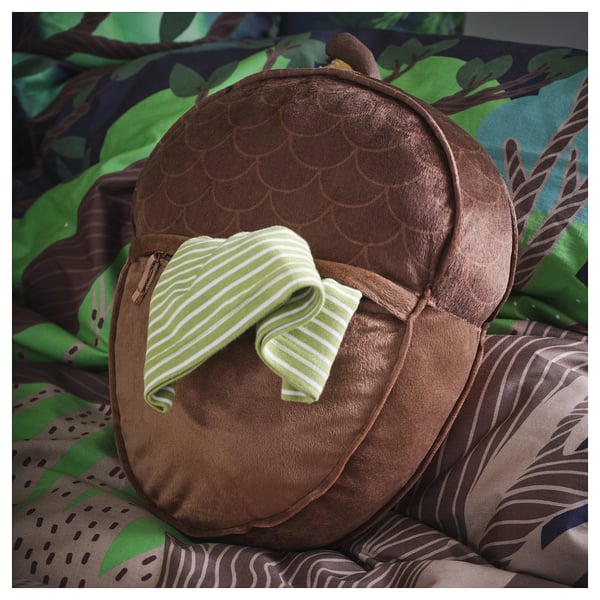 Plush acorn-shaped cushion with zip pocket for small items. Designed for kids, filled with recycled polyester for comfort and support.