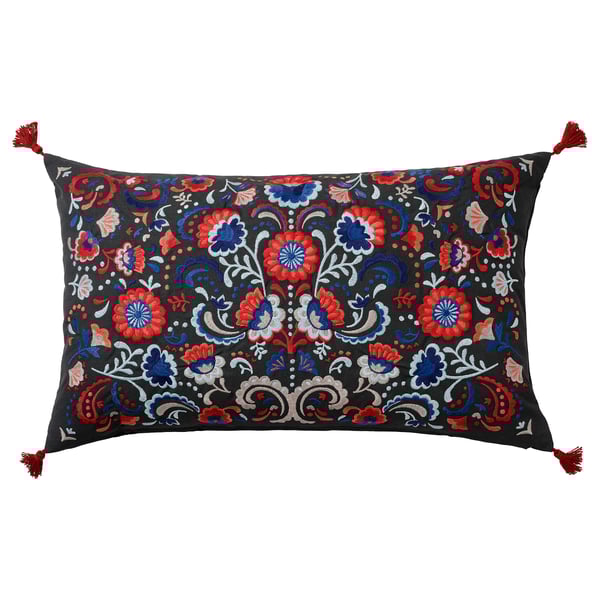 Vibrant floral embroidered rectangle cushion in dark base, red, blue, with tassels & duck feather filling.