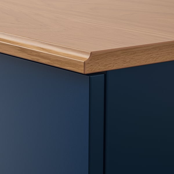 Close-up of SKRUVBY sideboard edge, showcasing smooth wood grain texture and sturdy join.