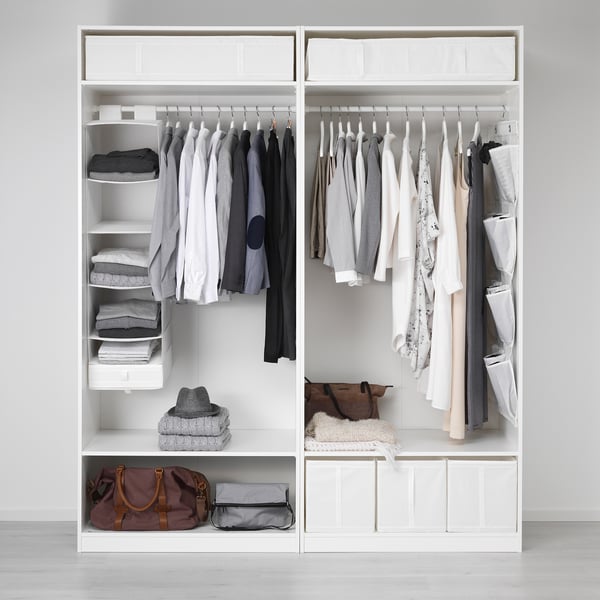 Open wardrobe with SKUBB boxes organising socks, accessories in compartments, hanging clothes neatly.