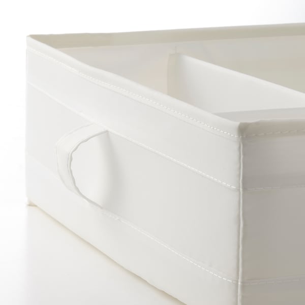 Close-up of white fabric storage box with reinforced stitching and side handles, designed for space efficiency.