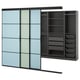 A SKYTTA wardrobe with blue-tinted glass doors, black frames, and organized storage including shelves and baskets.