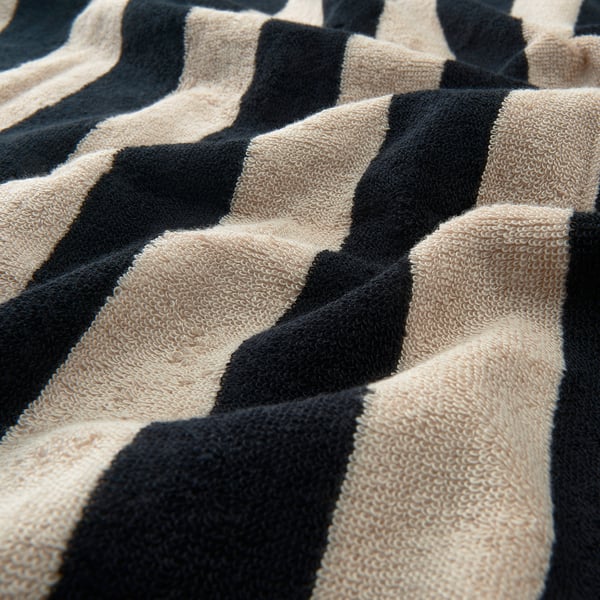 Striped towel close-up showcasing its soft, high-quality cotton texture.