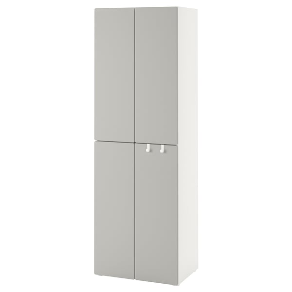 A SMÅSTAD wardrobe in white. It is a tall, rectangular cabinet with two doors featuring soft-close hinges, suitable for a small space.