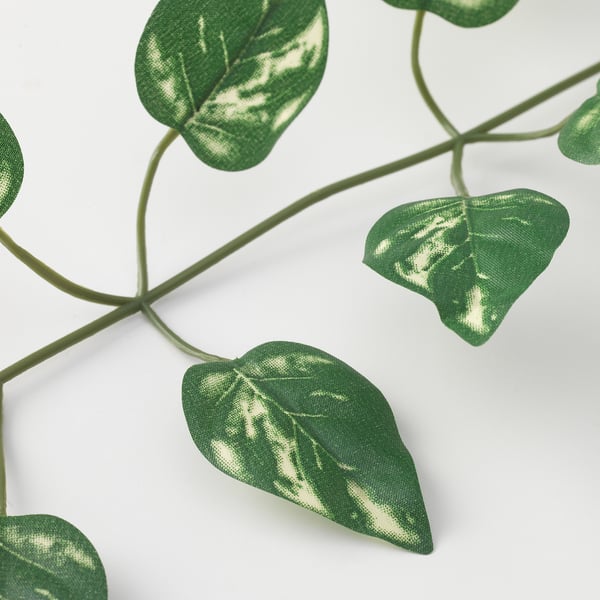 Artificial plant with vivid green, veined leaves and bendable stems. Realistic and eco-friendly.