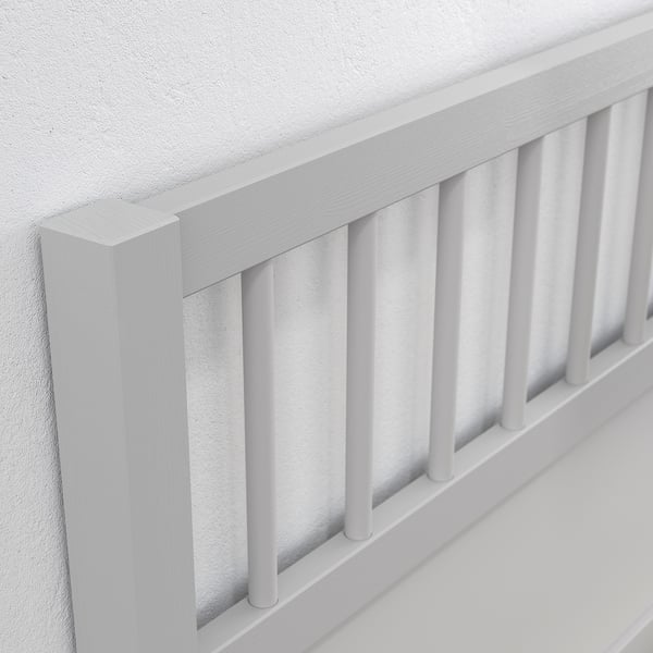 White wooden crib rail with smooth finish