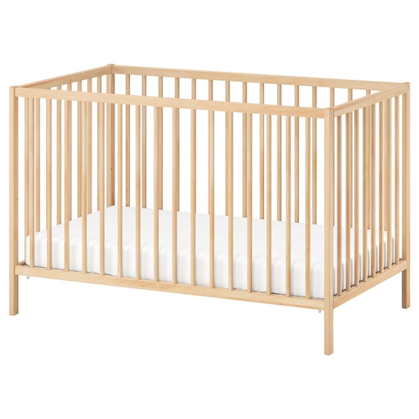 SNIGLAR: light wooden baby crib with light mattress, rectangular shape.