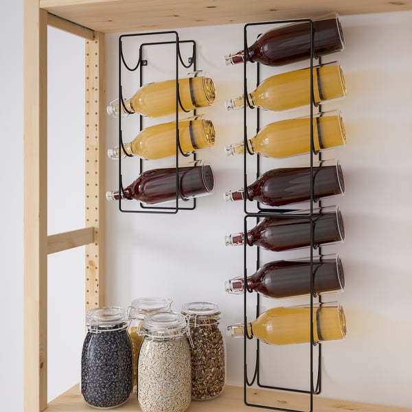 Wine bottles stored on metal wall-mounted racks. Three racks hold nine bottles, combining functionality and modern design for easy wall storage.
