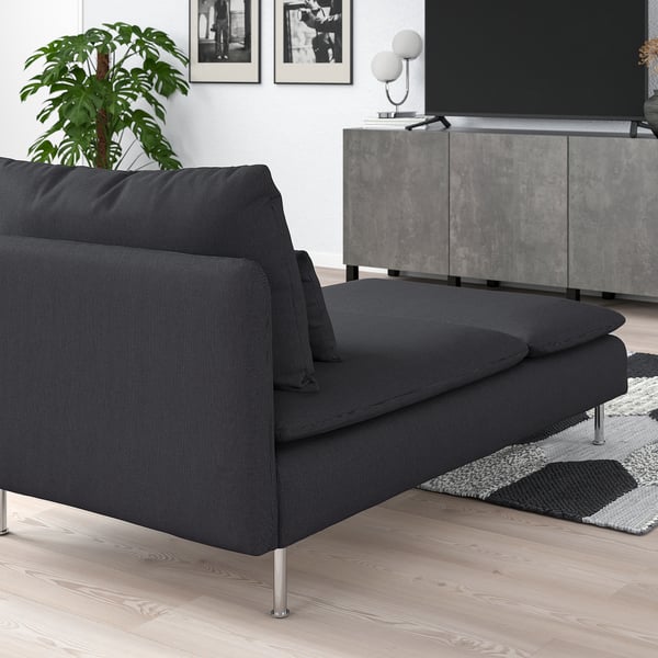 SÖDERHAMN dark grey chaise lounge, compact, cosy, modern design, with cushions, next to tv, rug and plant.