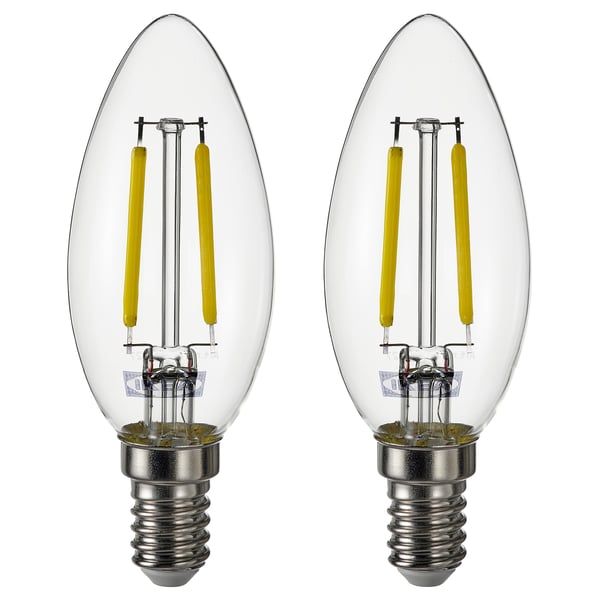 Two warm-white led light bulbs with clear glass covers and silver bases, sides by side.