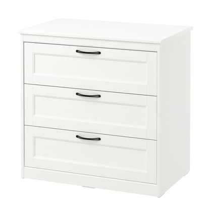 White chest of drawers, three drawers with handles, simple design.