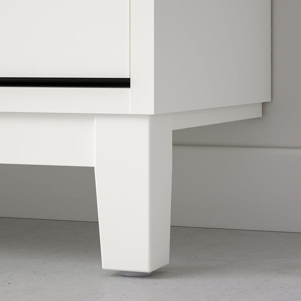 Modern white shoe cabinet, well-designed with sturdy legs, ensuring durability and easy access.