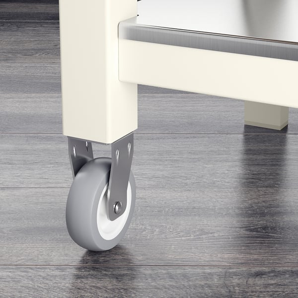 A white trolley with wooden wheels, showing sturdy construction for easy movement and stability.