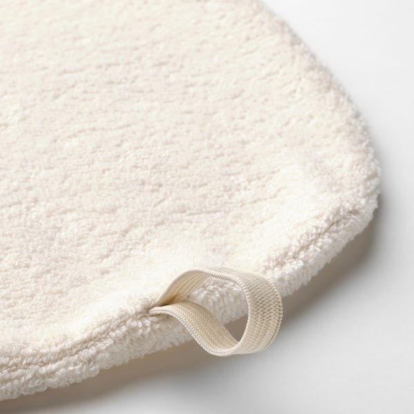 Close-up of a soft, looped hair towel with an elastic loop fastener.