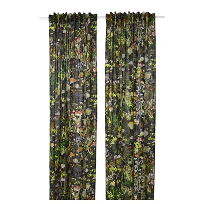 Two dark green curtains with colourful forest patterns hang side by side, adding a whimsical touch to any room.