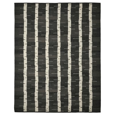 Grey and white handwoven wool rug with a birch tree pattern, rectangular shape. Part of the stockholm collection.