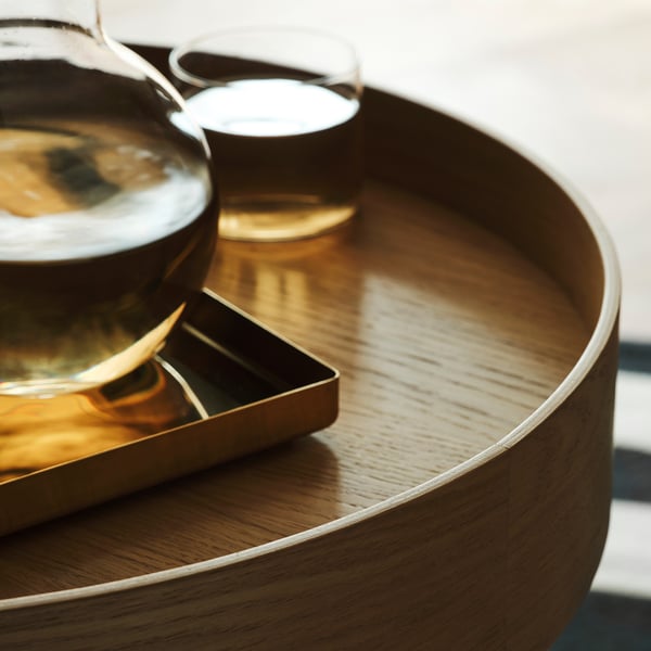 Wooden serving trolley with metallic tray detail, showcasing high-quality craftsmanship and sleek, minimal design.