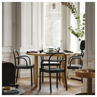Modern dining set with 4 chairs, by window.