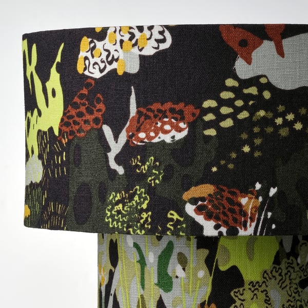 Linen lamp with vivid, nature-inspired pattern. Bright, eye-catching design. Soft, warm lighting. Quality craftsmanship.